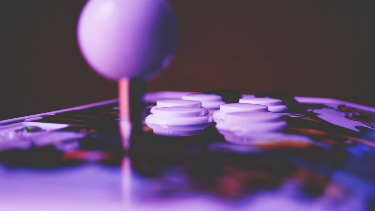Arcade fight stick with a ball-top lever and eight buttons