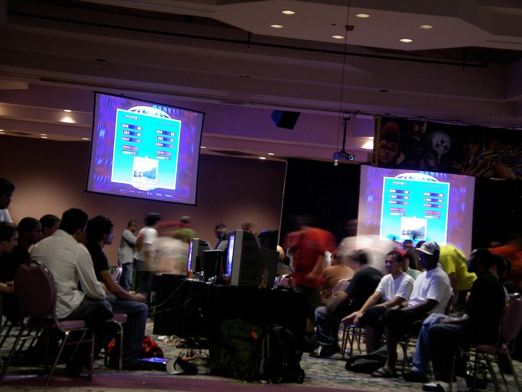 Big screens showing matches above the crowd at Evo 2008