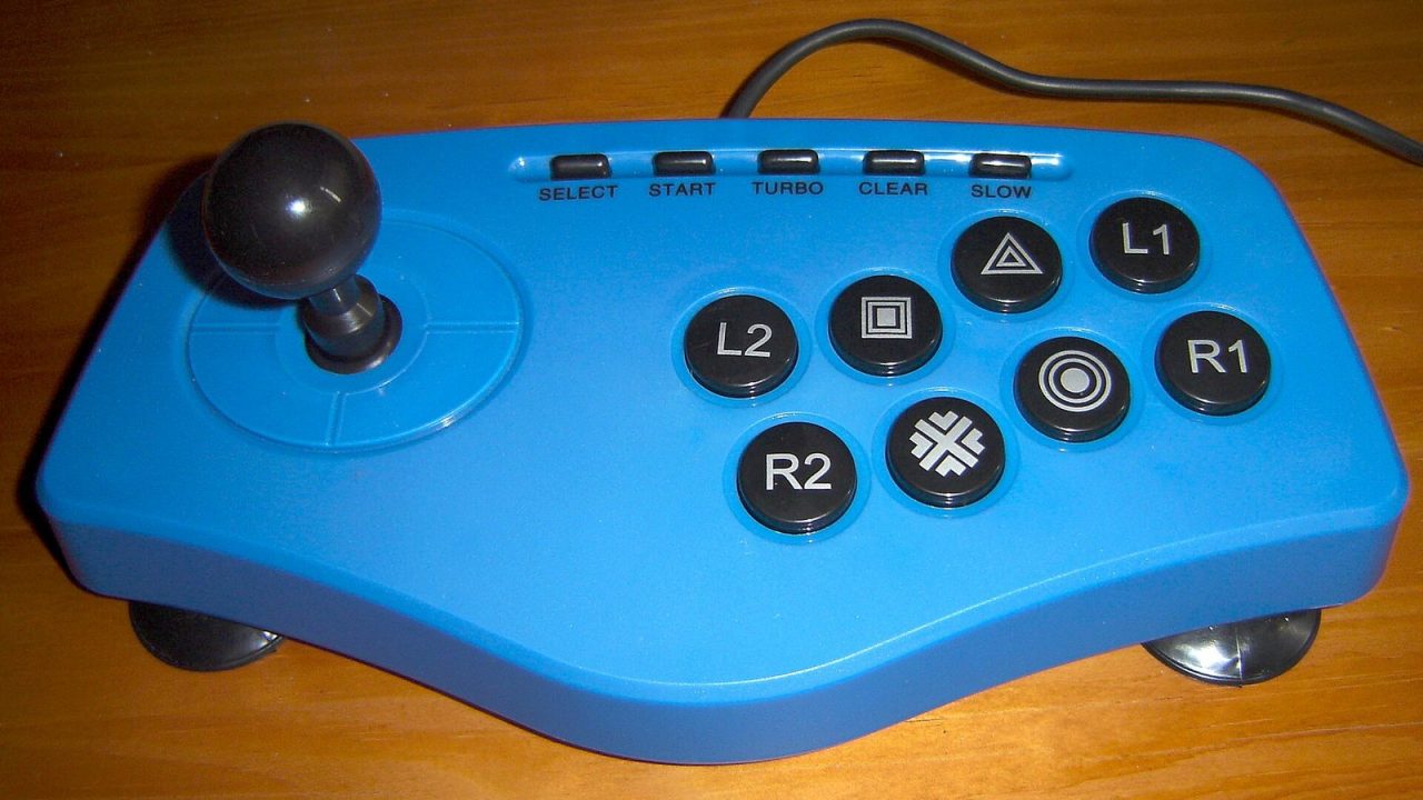Arcade-style controller with a ball-top joystick and six attack buttons